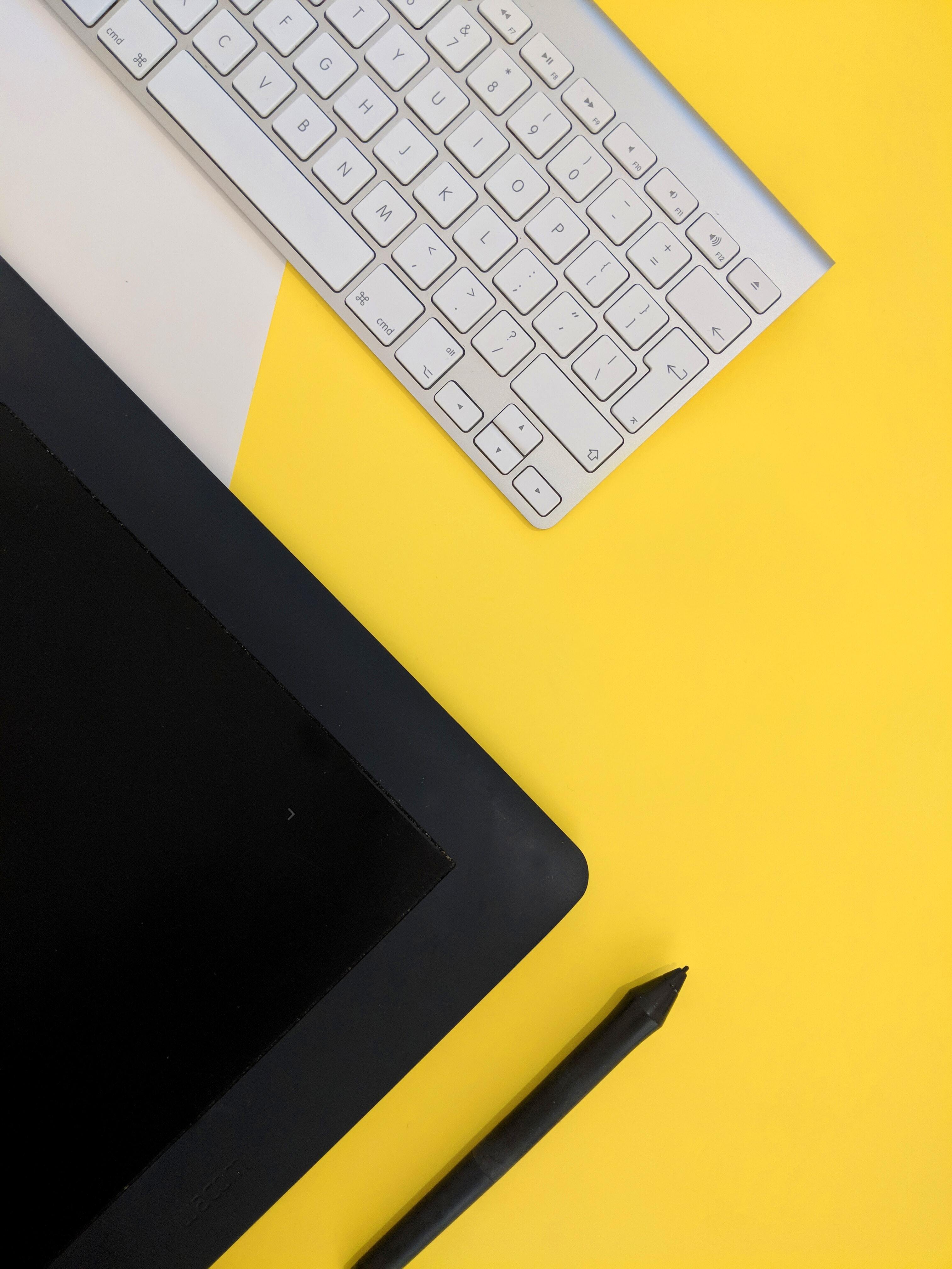 Yellow keyboard and pen